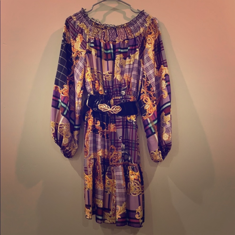 Dress made in Italy. Can fit S, M and L.